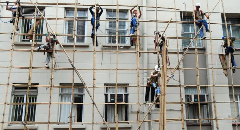 People building scaffolding